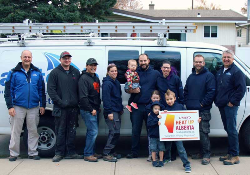 Several Airtech staff members in a picture with the family selected for the generous "Heat Up Alberta" Lennox event